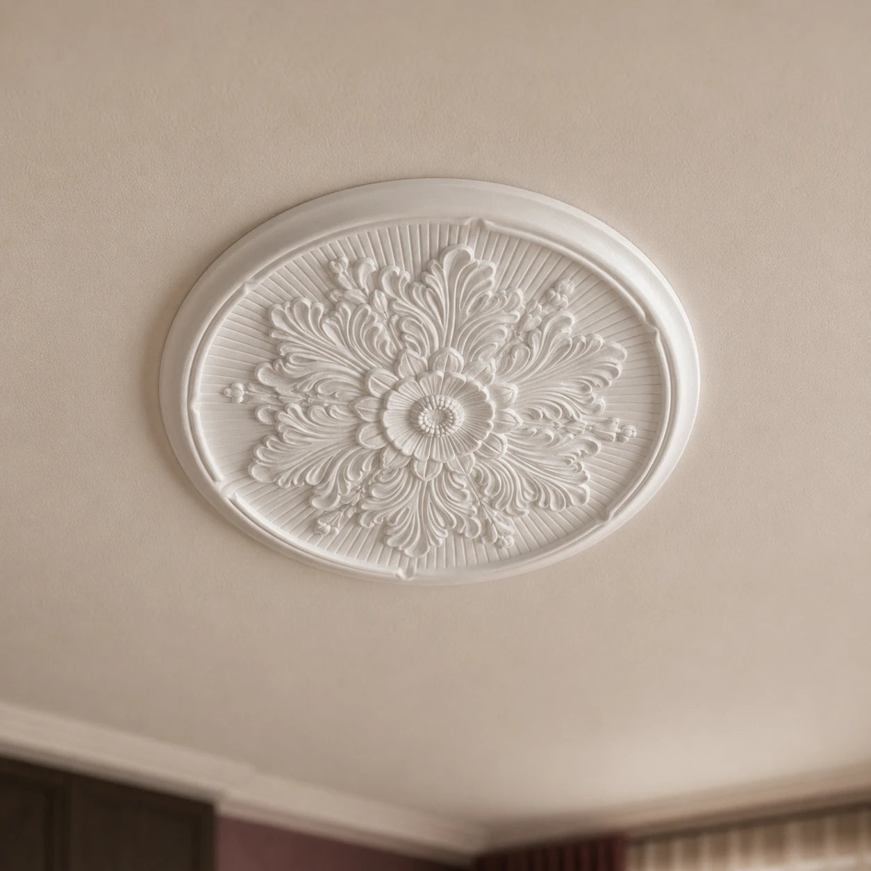 Close-up of the white Millennia R9 Arstyl ceiling rose with an intricate symmetrical floral and acanthus-leaf relief