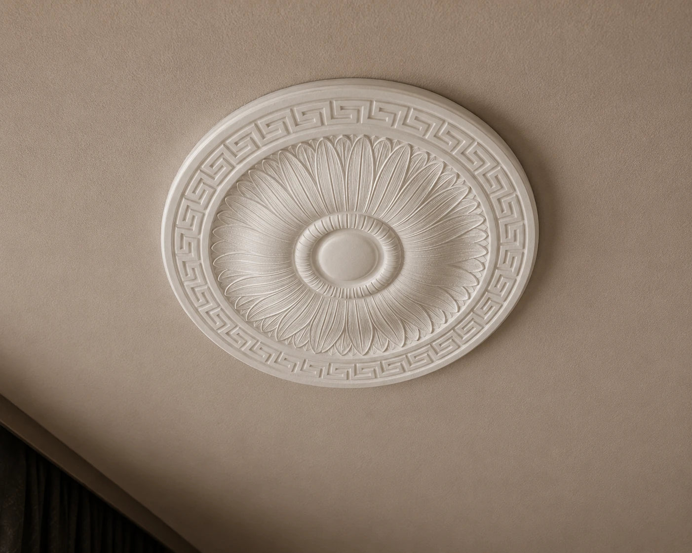 Close-up of the white R23 Arstyl ceiling rose with radiating leaf reliefs and a Greek key border